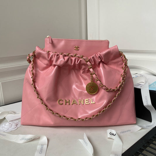 CHANEL 22 - SHINY CALFSKIN & GOLD TONE METAL, PINK