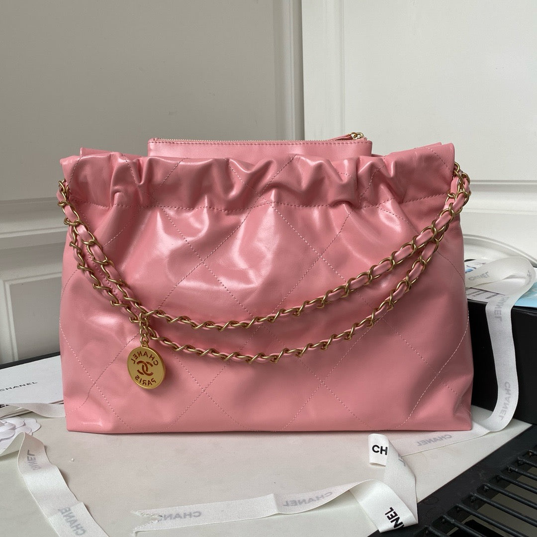 CHANEL 22 - SHINY CALFSKIN & GOLD TONE METAL, PINK